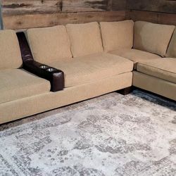 Vintage feather/down sectional with custom-built leather drink holder