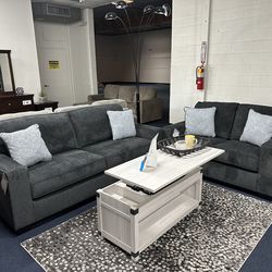 Dark gray sofa and loveseat