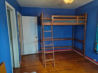 IKEA Twin size wood frame bunk bed.