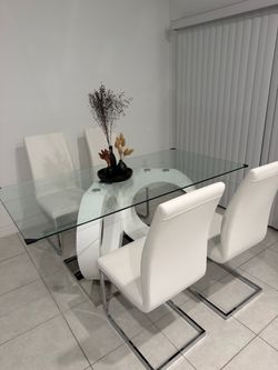 White dinning table with chairs