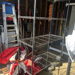 Sturdy heavy-duty metal wire shelving unit in great condition. Perfect for garage, storage, pantry, or gym setup.