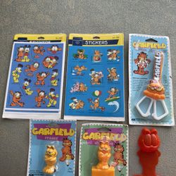 Vintage Garfield Lot Of 6 Scissors, Eraser, Pencil Sharpener Stickers And More Collectible  Items from 70’s. They are new but packaging shows wear. 5 
