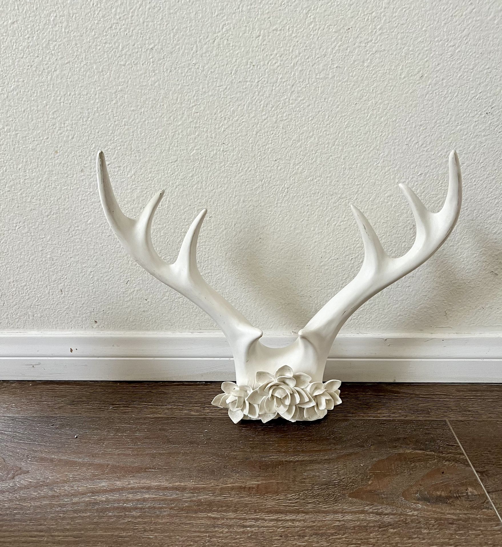Elegant White Antler Sculpture with Floral Accent fake
