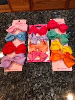 Girls Hair Bows Lot Of 12 Brand New Bows.  Size 2 1/2 - 3 inches Wide .  Brand new never removed from card .