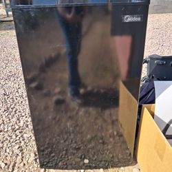Midea mini fridge in black. 