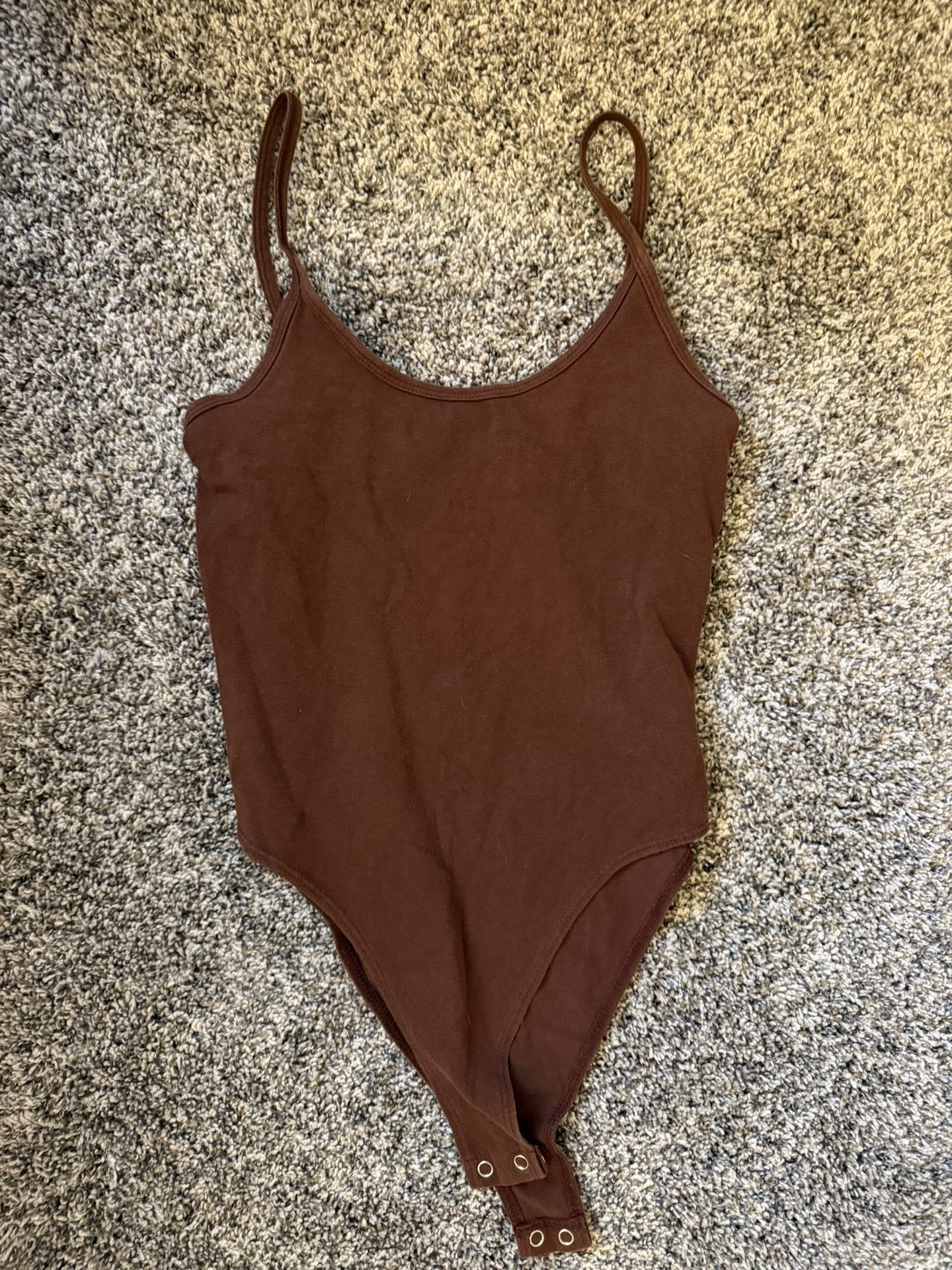 Brown body suit