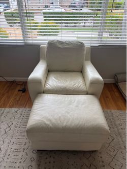 White leather armchair with ottoman