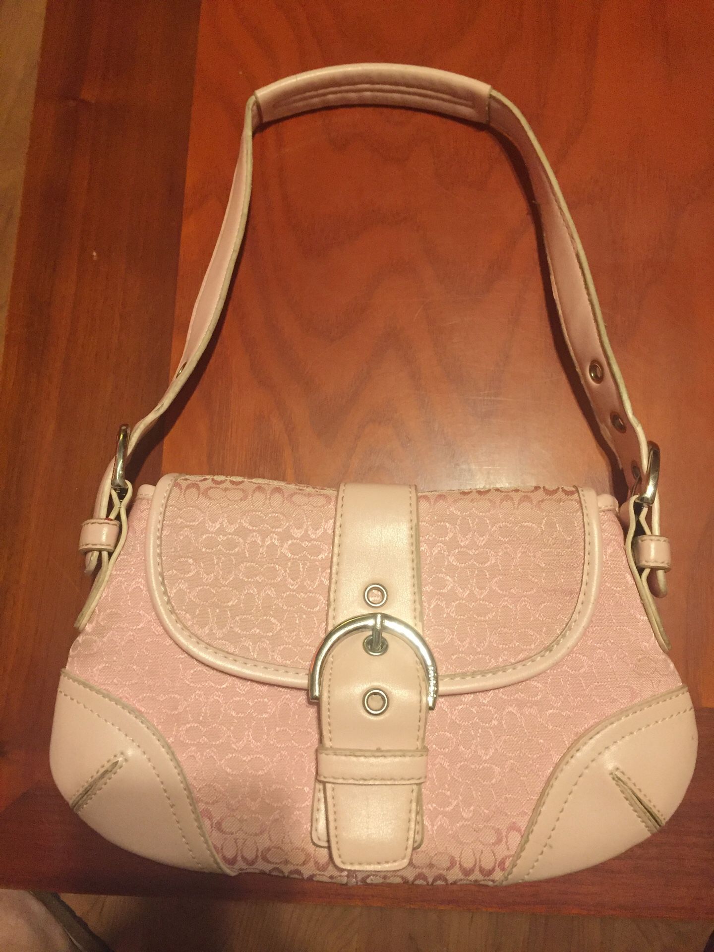 Small light pink coach purse. Used but good condition