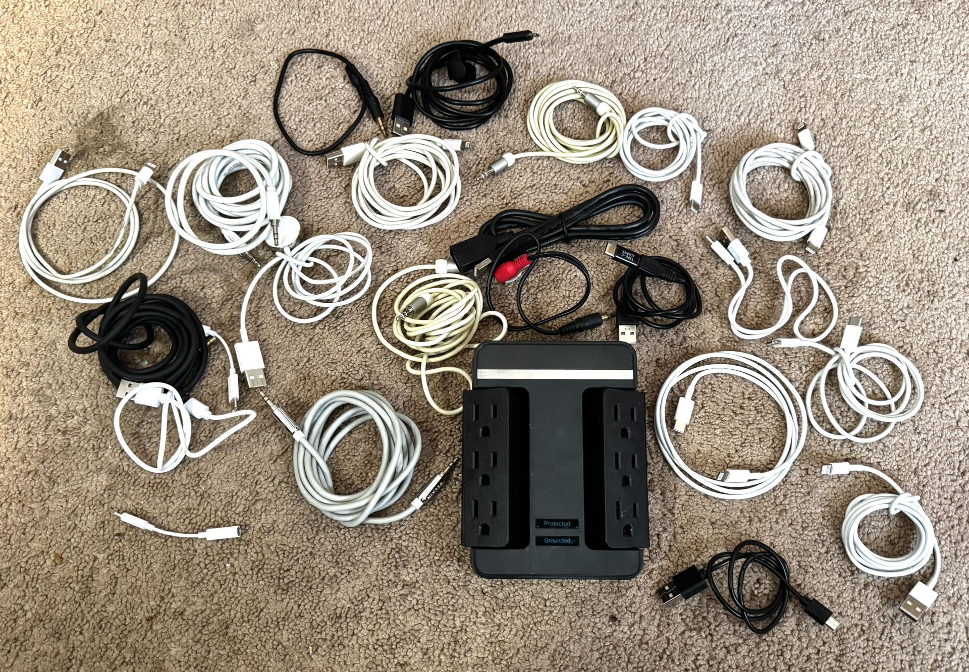 Numerous Apple, Usb, Usb-C, Usb, Lightning, And Apple Watch, Magsafe Adapters And Chords Plus A Rocket Fish Six Outlet Surge Adapter
