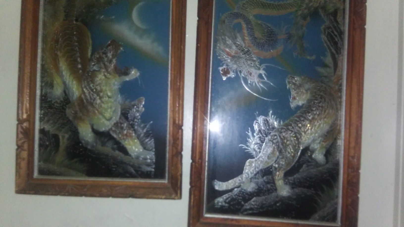 Buying both dragon and tiger Antique foil oriental art hand curved frames.