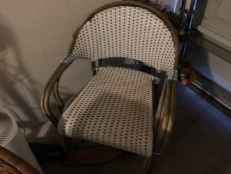 Pair woven indoor/outdoor chairs with matching table