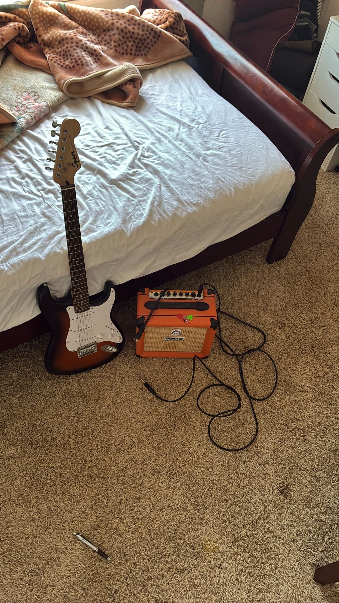 Squire stratocaster guitar with orange amp