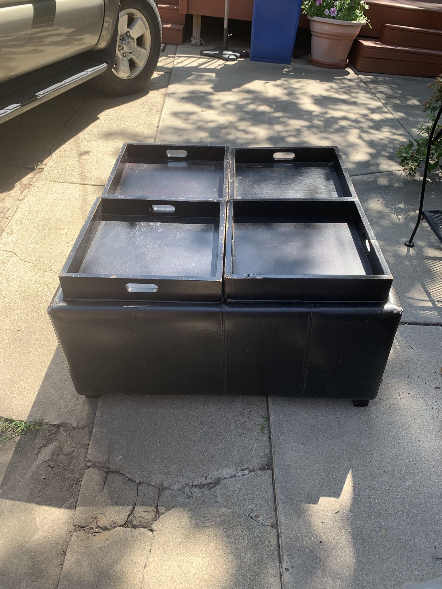 Black ottoman with removable trays