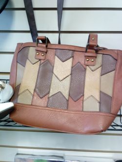 multicolor camel patchwork leather purse with a zipper closure and a long shoulder strap. 