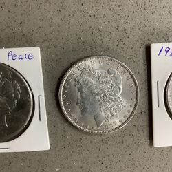 REDUCED PRICE,  $100 OFF EACH COIN!!!   BEAUTIFUL UNCIRCULATED MORGAN AND PEACE SILVER DOLLARS.    THEY WERE BOUGHT AND NEVER USED. 