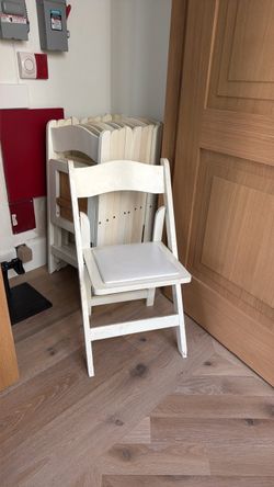 White wooden foldable chairs