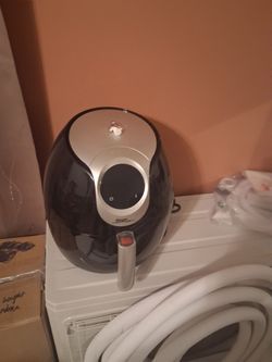 Black and silver air fryer with fryer basket