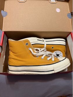 Converse Chuck Taylor All Star 70s yellow high top trainers.
