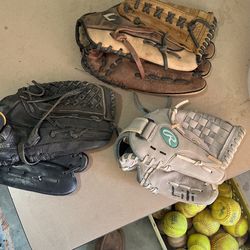Base Ball Gloves. And Crate Of Base Balls And Soft Balls