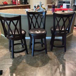 3 Brown Swivel Bar Stools 
