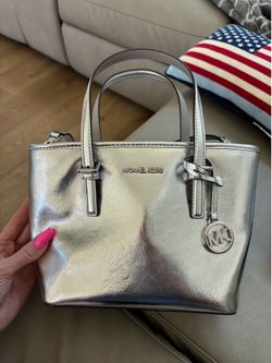 Michael Kors new with tags never use silver Crossbody