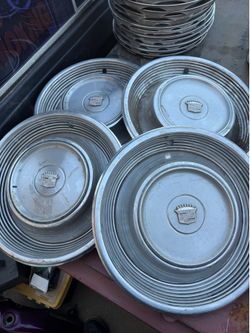 69-69 Cadillac hubcaps