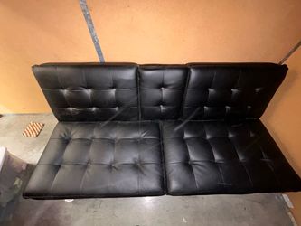 Futon/couch combo. Faux leather. Good condition