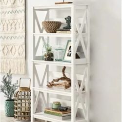 Contemporary, sleek book shelf / decor display cabinet. Has lovely X-design on the sides. 