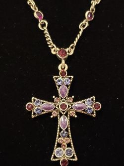 $10. Lia Sophia purple rhinestone cross necklace. Necklace is silver tone. Necklace is 20 in. Cross pendant is 2 in long and 1 and 1/4-in wide.