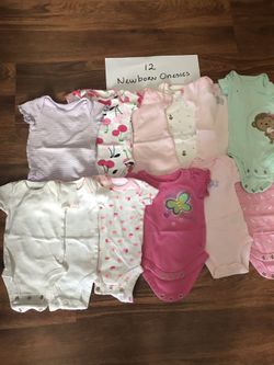 12 NEWBORN girl onesies ( barely used )