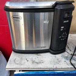 Butterball Professional Series indoor electric turkey fryer with a stainless steel cooking pot and a 20-pound capacity