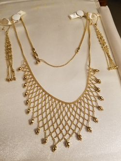 14 K Gold necklace and earrings. 18 inches long . Like new.