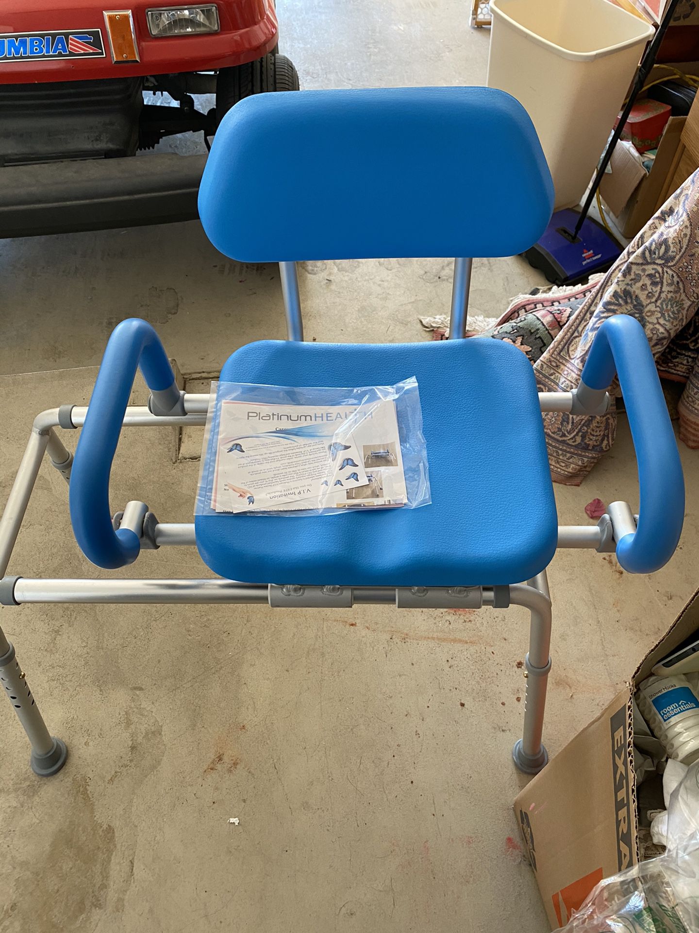 Shower chair: adjustable legs so half can be in tub and half on floor sliding and swivel seat. Never used $80