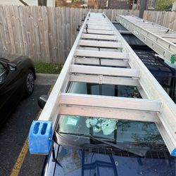 32 foot aluminum (blue tip) Ladder (1 damaged lock)