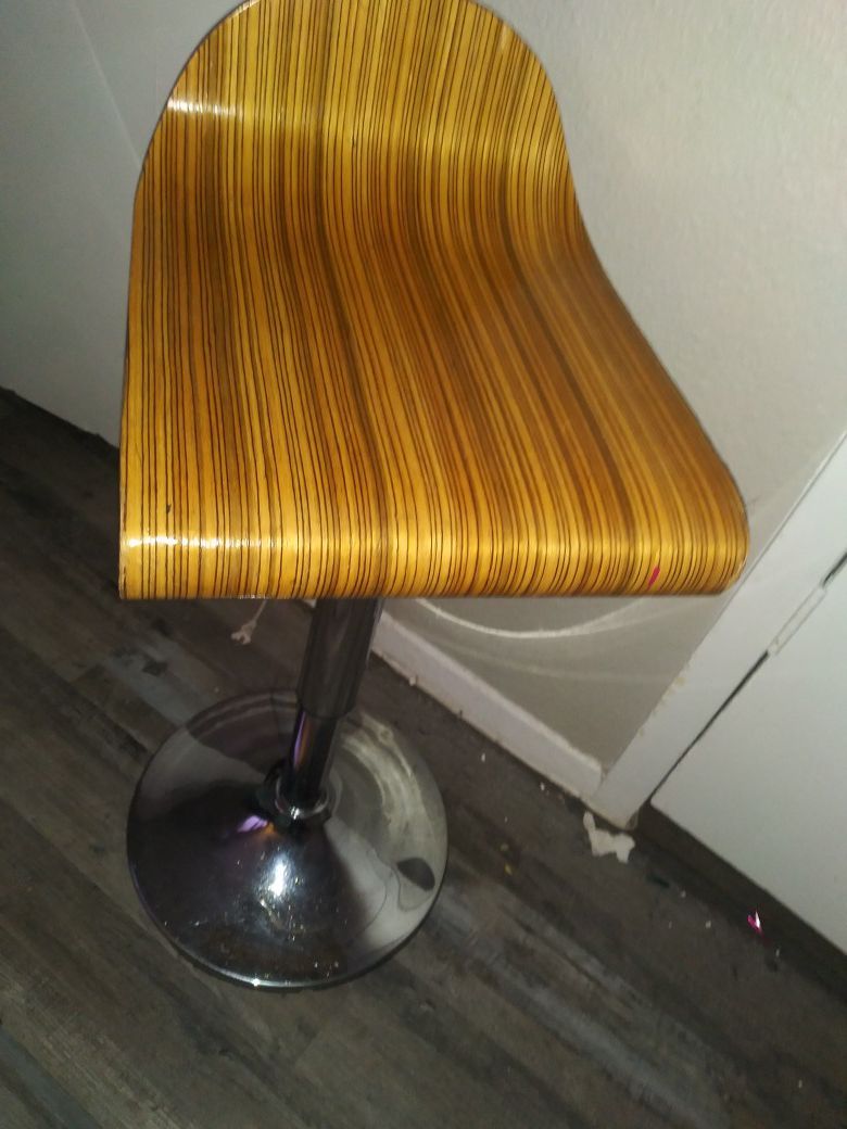 Hydraulic lift light colored wood bar stool