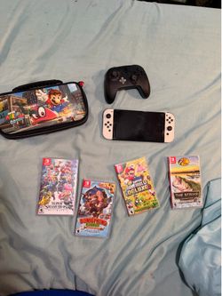 Nintendo switch oled with games and dock