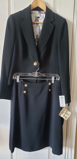 Tahari Arthur S. Levine black skirt suit with gold buttons and a patterned lining.