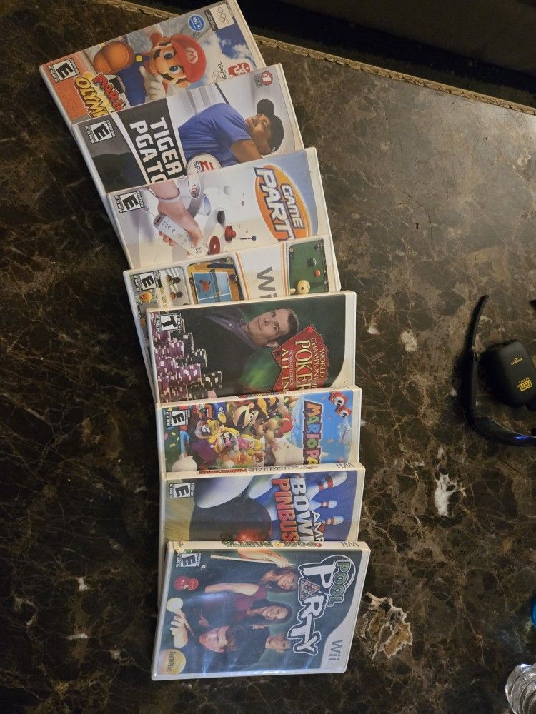 NINTENDO WII WITH 7+ GAMES AND 4 SETS OF HEADPHONES INCLUDED