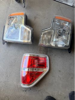 2009 - 2014 Ford F150, OEM front headlight assembly and passenger side rear light assembly