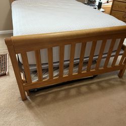 Solid Oak Sleigh Full Size Bed With A Trundle Bed,10 Pieces All In Great Condition. Full Size Mattress Not Included. Trundle Mattress Is Included.