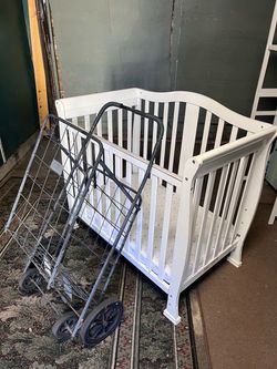 Mini crib assembled and grocery cart