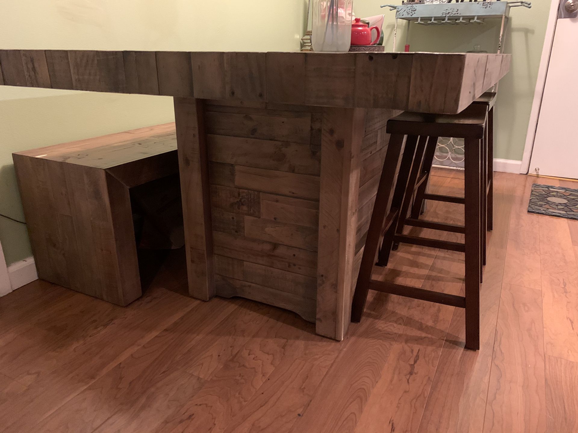 Wooden dining table, bench, and stools