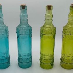 Set of four tall New glass bottles with cork