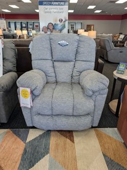 Power recliner with adjustable headrest