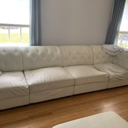 White Leather Sofa And 2 Ottomans