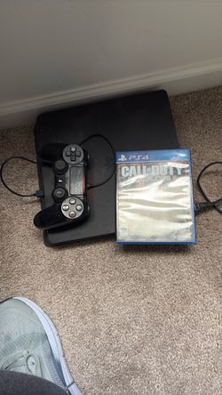 PS4 with one controller and one game