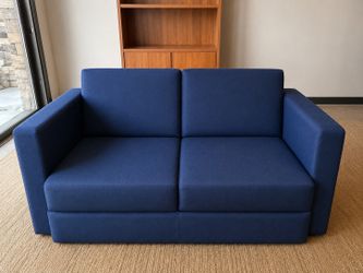 Clean blue office / bedroom couch