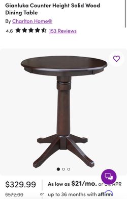 Counter-height dining table and two swivel stools