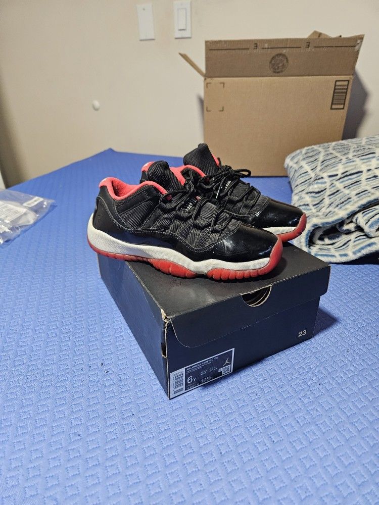 Red And Black Jordan 11s size 6
