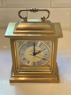 Vintage Arthur Thomas “Rapture” quartz carriage-style desk alarm clock.